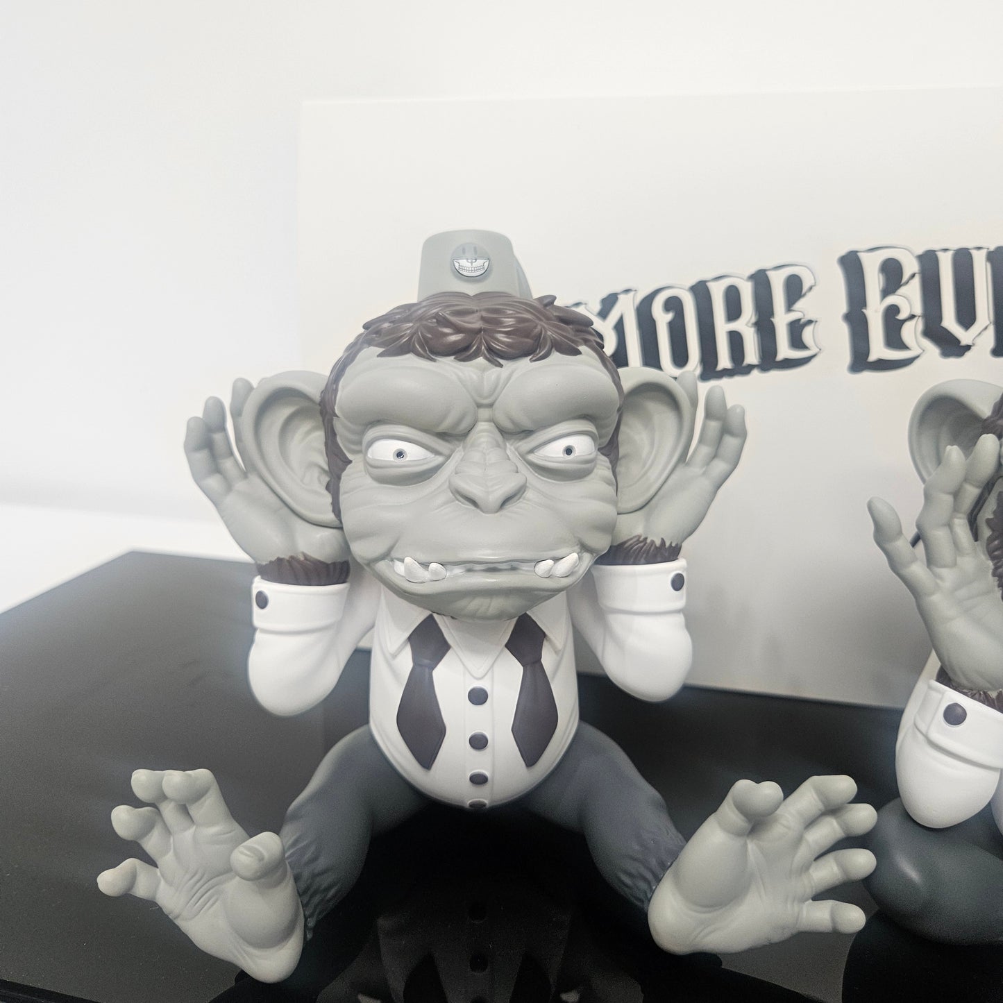 Close up of Ron English  "Hear No Evil" Monkey figure