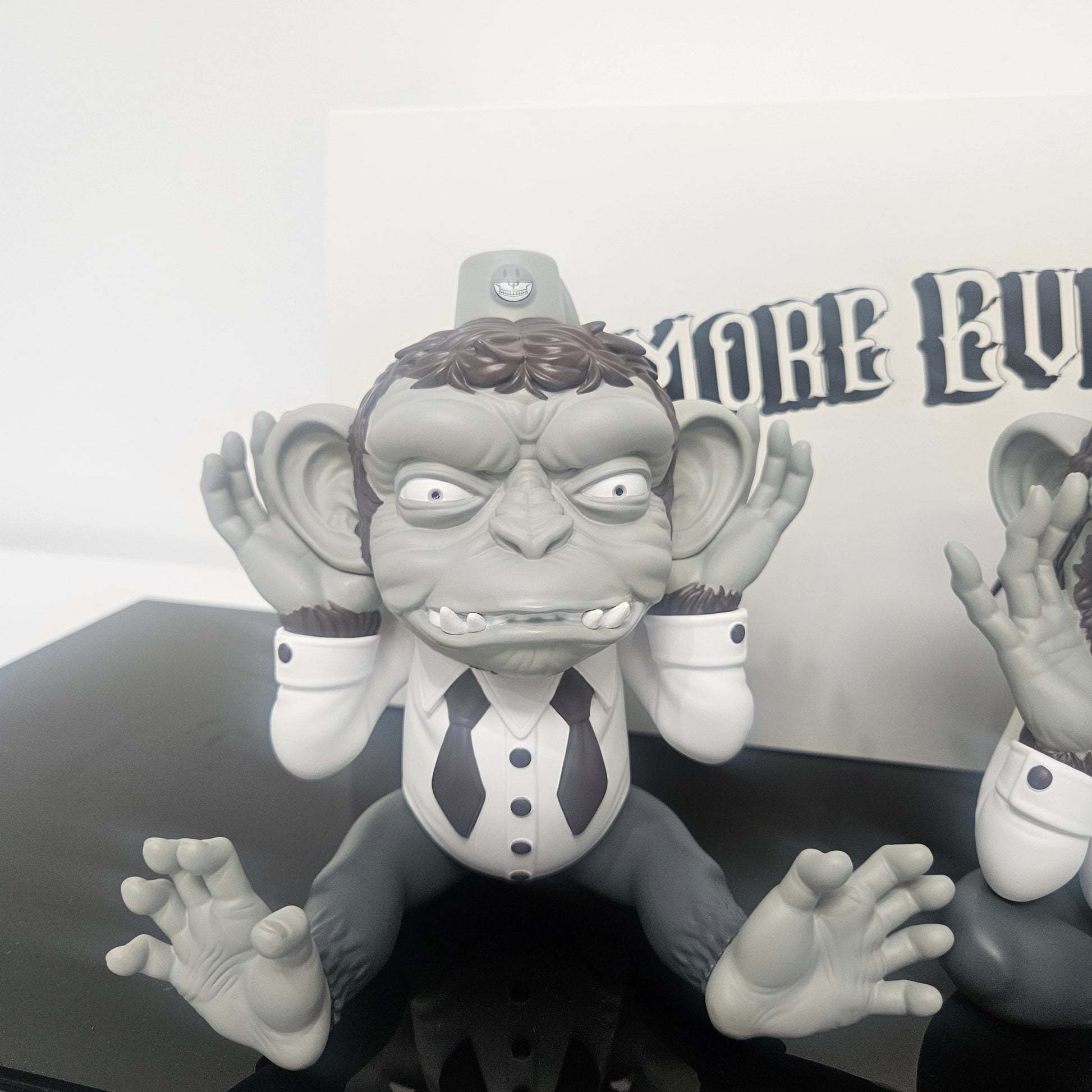 Close up of Ron English  "Hear No Evil" Monkey figure